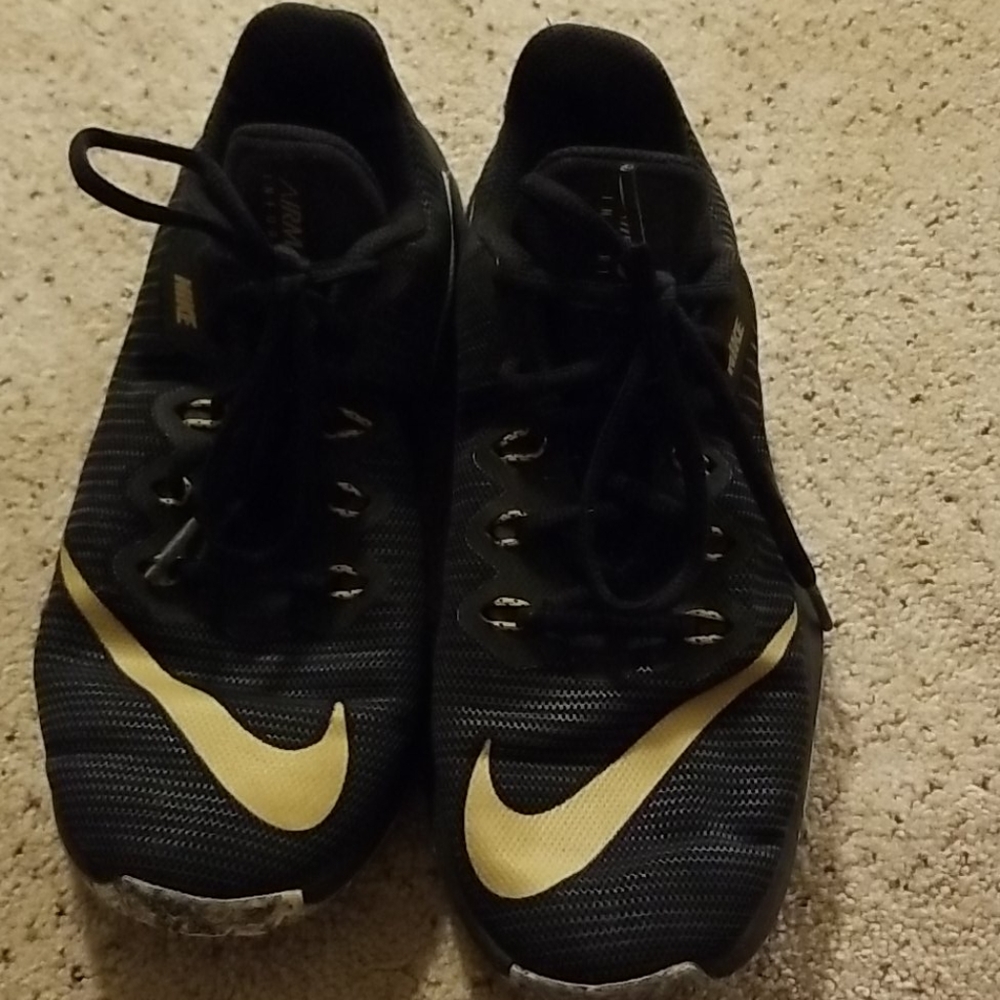 Black and gold Nike's
